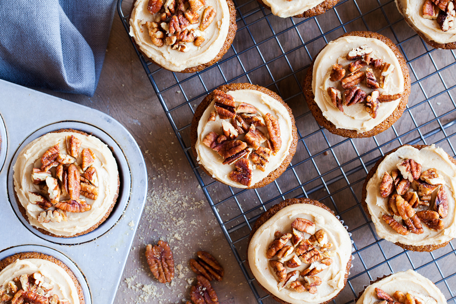 Sprinkles Brown Sugar Praline Cupcakes, directly from Candace Nelson, are incredibly moist, topped with a thick brown sugar frosting, and sprinkled with crunchy candied pecans!