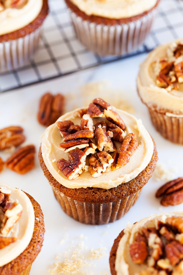 Sprinkles Brown Sugar Praline Cupcakes, directly from Candace Nelson, are incredibly moist, topped with a thick brown sugar frosting, and sprinkled with crunchy candied pecans!