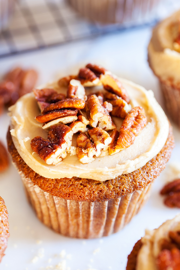 Sprinkles Brown Sugar Praline Cupcakes, directly from Candace Nelson, are incredibly moist, topped with a thick brown sugar frosting, and sprinkled with crunchy candied pecans!