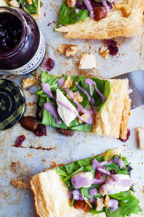 Puff pastry topped with fresh greens and a drizzle of blueberry lemon dressing make this Chicken Waldorf Salad Tart a delicious appetizer or light lunch option for all your holiday parties.