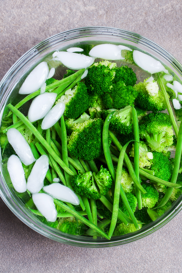 Perfectly crisped, tender, and flavorful Garlic Lemon Broccoli and Green Beans.