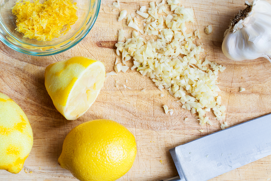 Preparation step for Ina Garten's Lemon Chicken - ingredients on cutting board