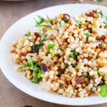 Sweet and savory Lemon Israeli Couscous with Dates and Walnuts, with just a bit of tang, makes a delicious accompaniment to your favorite entrees.