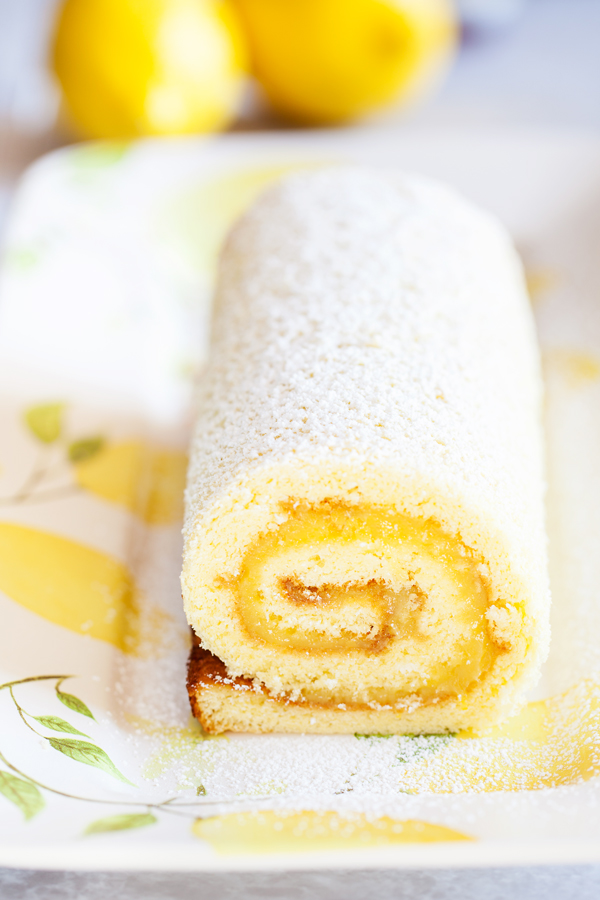 Soft and tender cake filled with lemon curd and rolled into a log makes this Lemon Jelly Roll a beautiful and impressive dessert for your guests this Easter and summer.