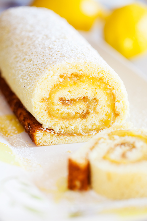 Soft and tender cake filled with lemon curd and rolled into a log makes this Lemon Jelly Roll a beautiful and impressive dessert for your guests this Easter and summer.