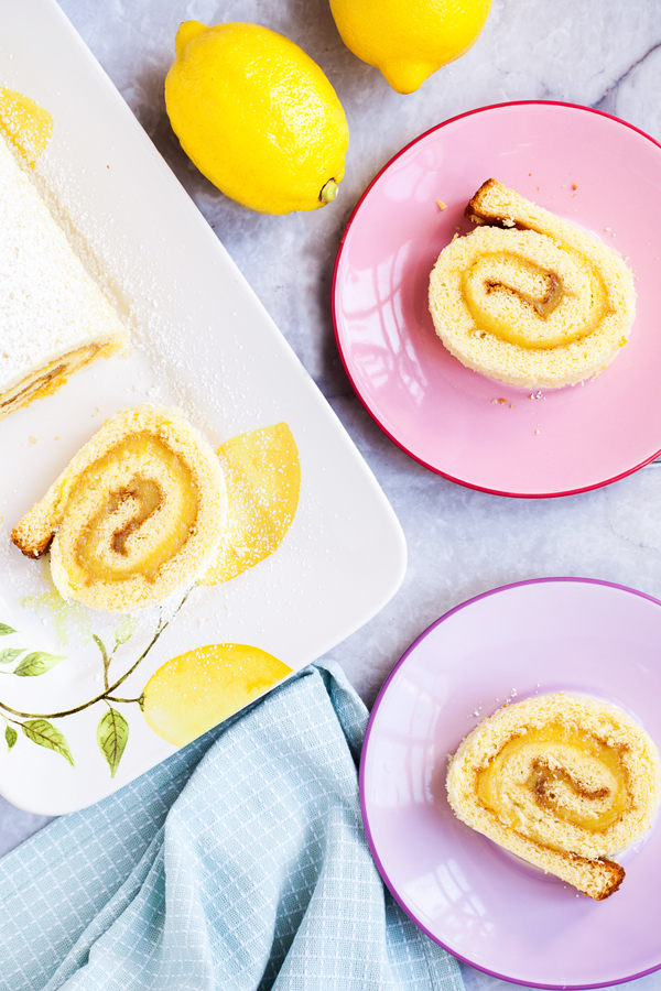 Soft and tender cake filled with lemon curd and rolled into a log makes this Lemon Jelly Roll a beautiful and impressive dessert for your guests this Easter and summer.