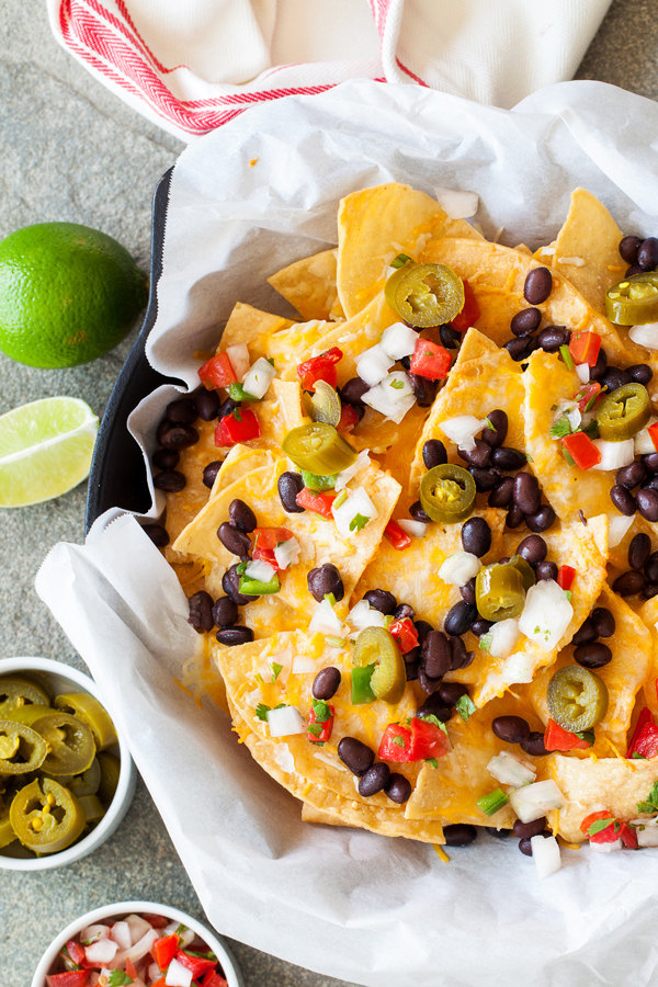 These Better than Restaurants Skillet Nachos gives you cheese in every bite and is topped with plenty of toppings.