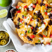 These Better than Restaurants Skillet Nachos gives you cheese in every bite and is topped with plenty of toppings.