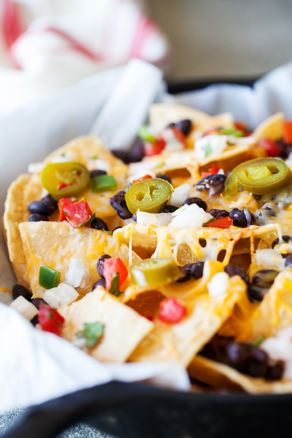 These Better than Restaurants Skillet Nachos gives you cheese in every bite and is topped with plenty of toppings.