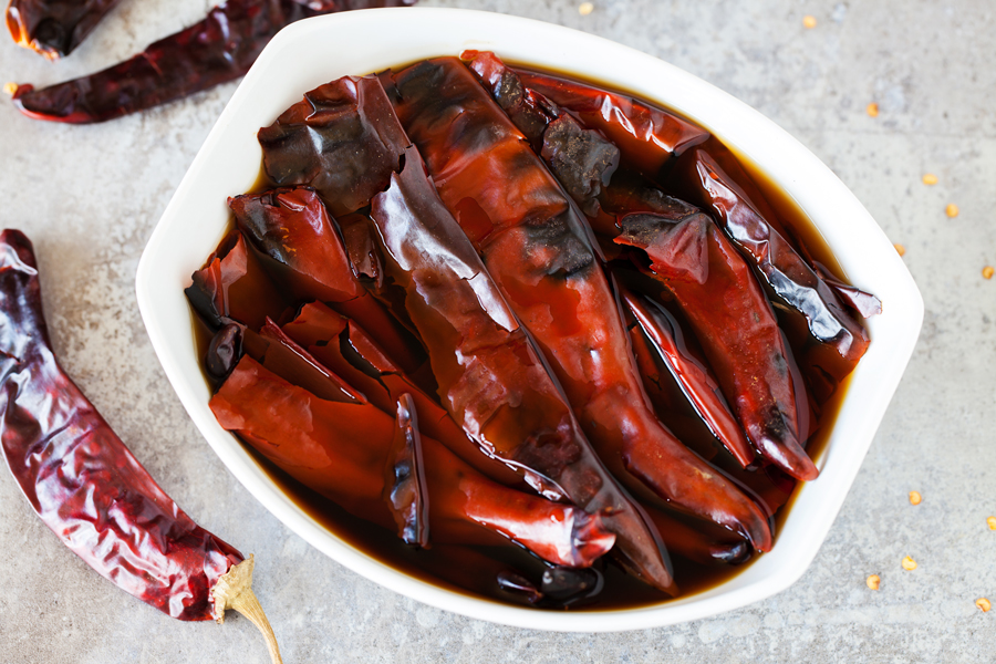 A rich and thick Red Enchilada Sauce made entirely from scratch using fresh garlic and guajillo chilis.