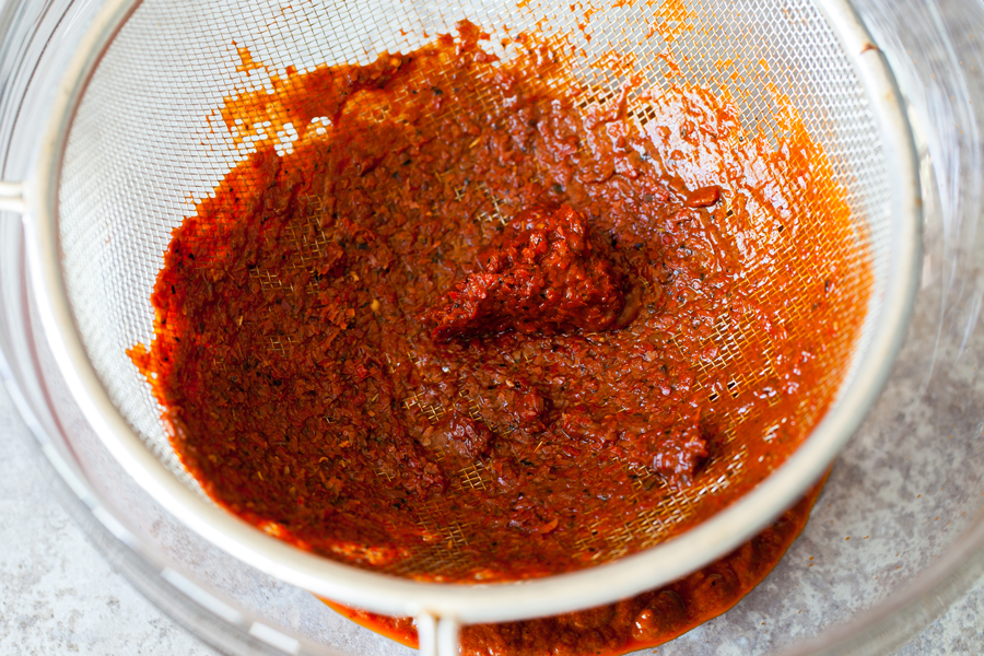 A rich and thick Red Enchilada Sauce made entirely from scratch using fresh garlic and guajillo chilis.