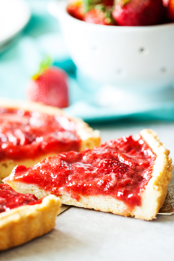 Bursting with strawberry flavor, this Strawberry Tart is loaded with fresh strawberries floating atop a melt-in-your-mouth pate sucrée crust.