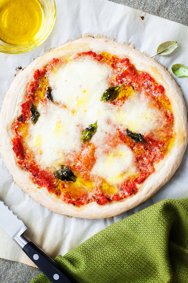 A classic and always a favorite, this Margherita Pizza layers fresh mozzarella, basil, and olive oil on top of a homemade pizza sauce and from-scratch crust.