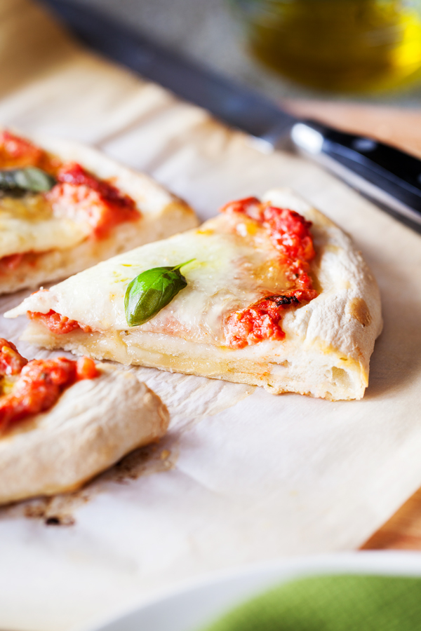 A classic and always a favorite, this Margherita Pizza layers fresh mozzarella, basil, and olive oil on top of a homemade pizza sauce and from-scratch crust.