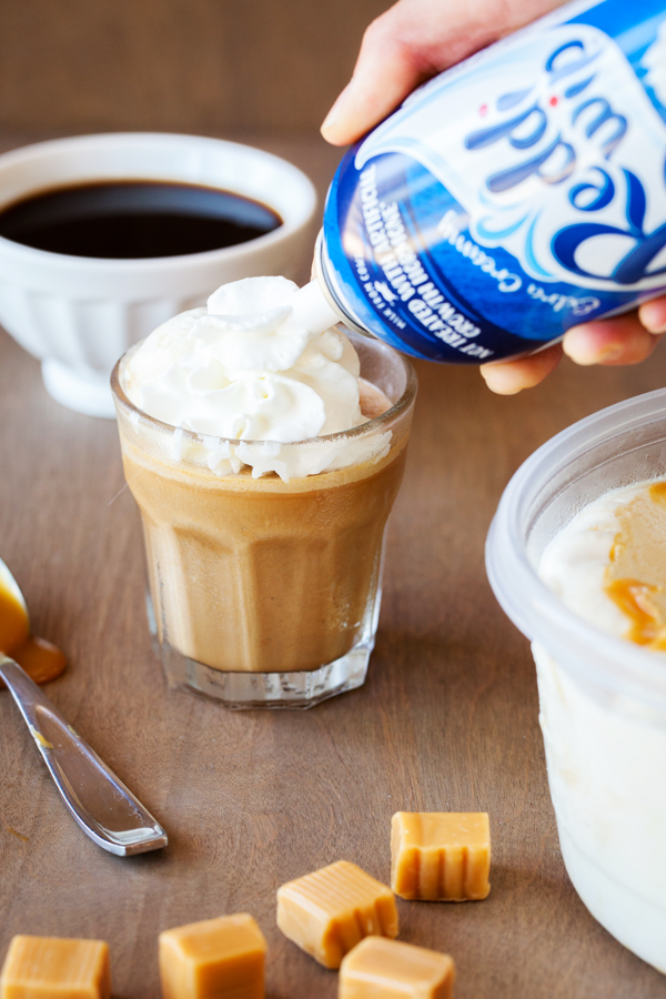 A summer-worthy treat, French Vanilla and Caramel Affogato Frappe tops homemade frappe with a scoop of no-churn caramel ice cream.