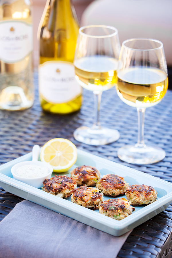 Pan fried Crab Cakes with succulent lump crab meat and fresh herbs.