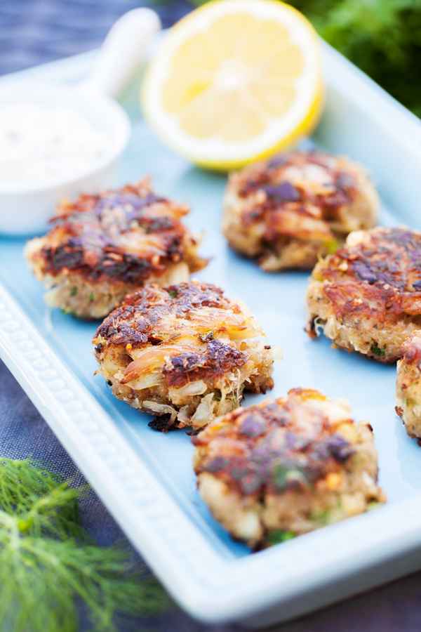 Pan fried Crab Cakes with succulent lump crab meat and fresh herbs.