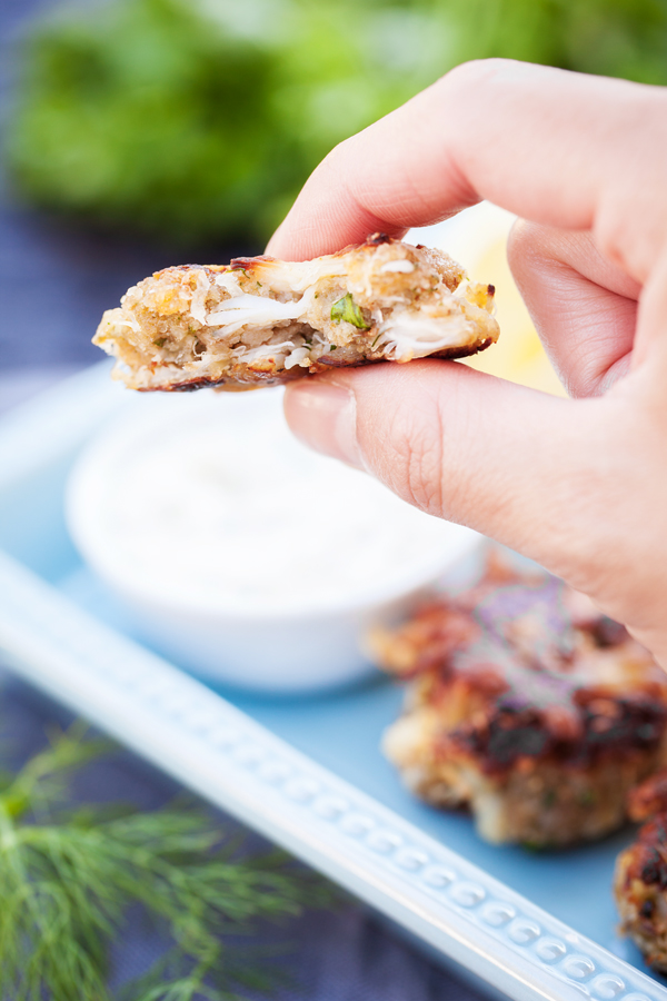 Pan fried Crab Cakes with succulent lump crab meat and fresh herbs.