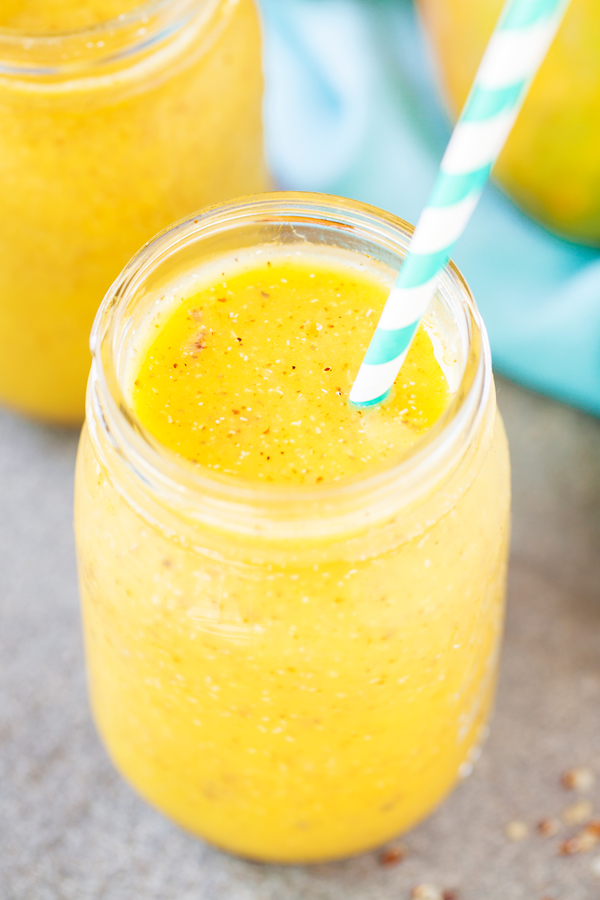 Mango Quinoa Smoothie in mason jar with straw. 