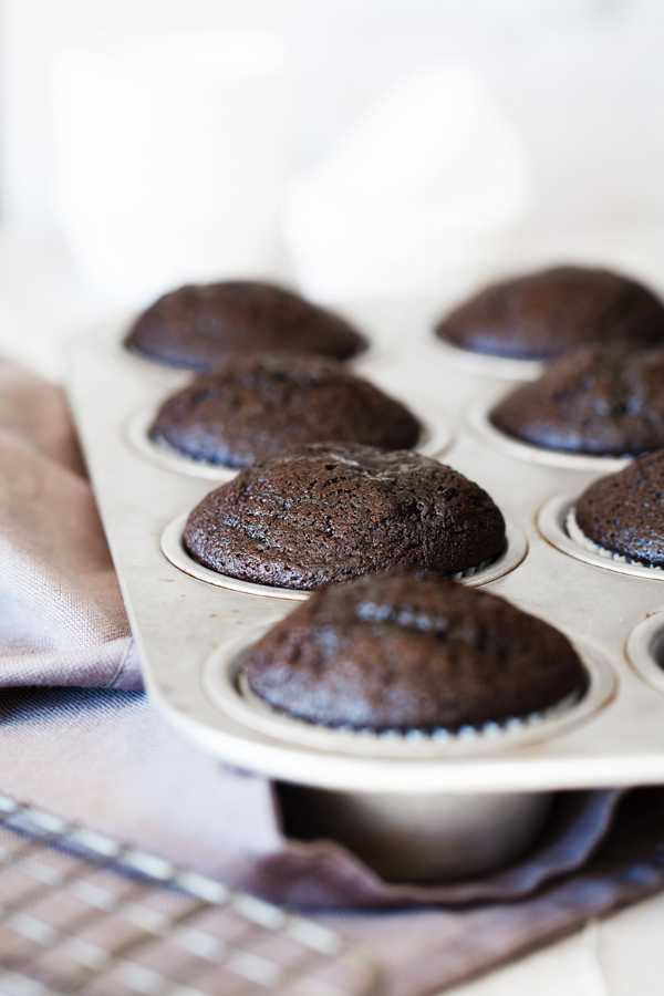 Chocolate cupcakes in baking pan. 