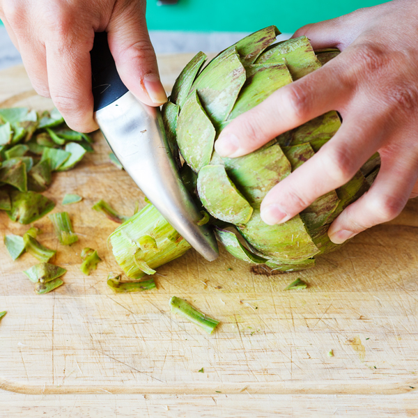 Peeling of an artichoke stem. 