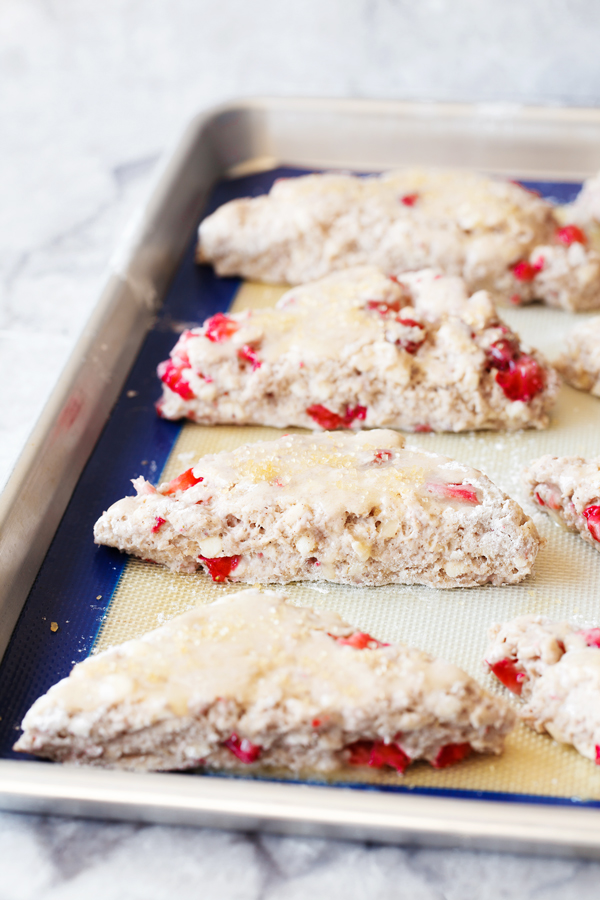 Raw strawberry scone dough on a baking sheet. 