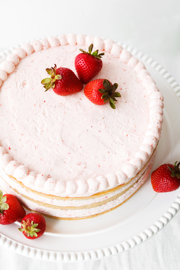 Overhead view of whole fresh strawberry cake