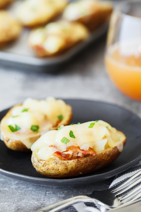 Cheesy Bacon Garlic Stuffed Potato Skins on a plate.