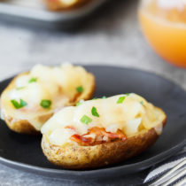 Cheesy Bacon Garlic Stuffed Potato Skins on plate