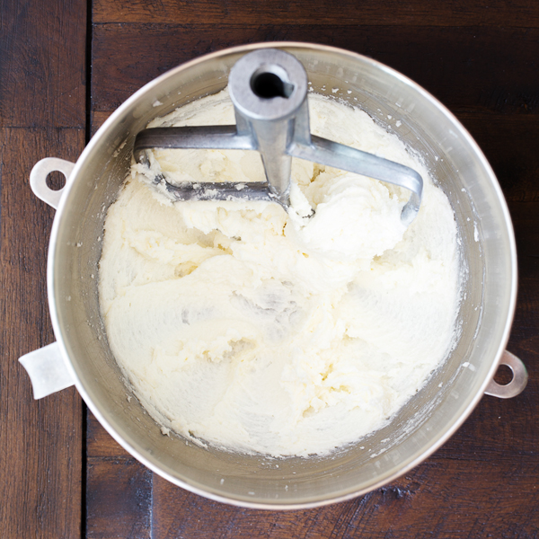 Preparation step for pumpkin spice cupcakes - butter and sugar creamed together in bowl of a stand mixer.