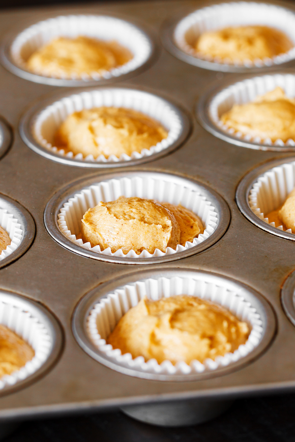 Preparation step for pumpkin spice cupcakes - batter in muffin tray.