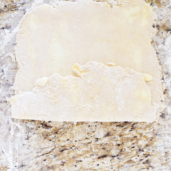Preparation step for flakey all-butter pie crust - folded slab of pie dough