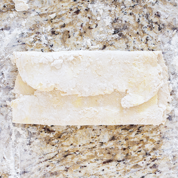 Preparation step for flakey all-butter pie crust - folded slab of pie dough