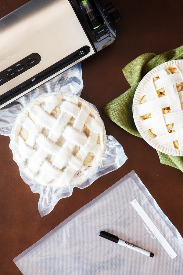 Flat lay view of classic apple pie being vacuum sealed with FoodSaver