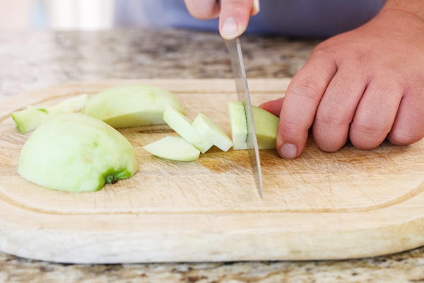 Apple being sliced.