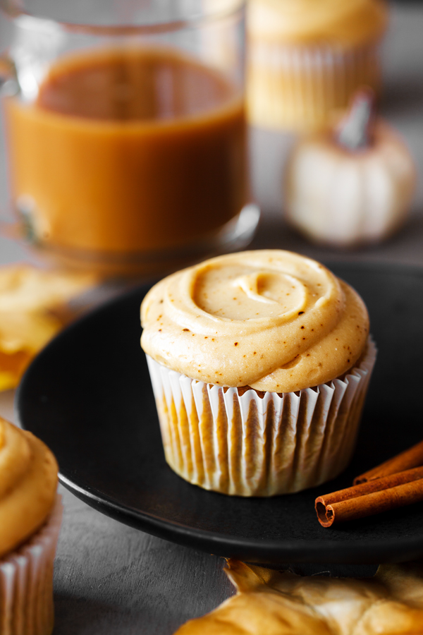 Pumpkin spice latte cupcake on plate.