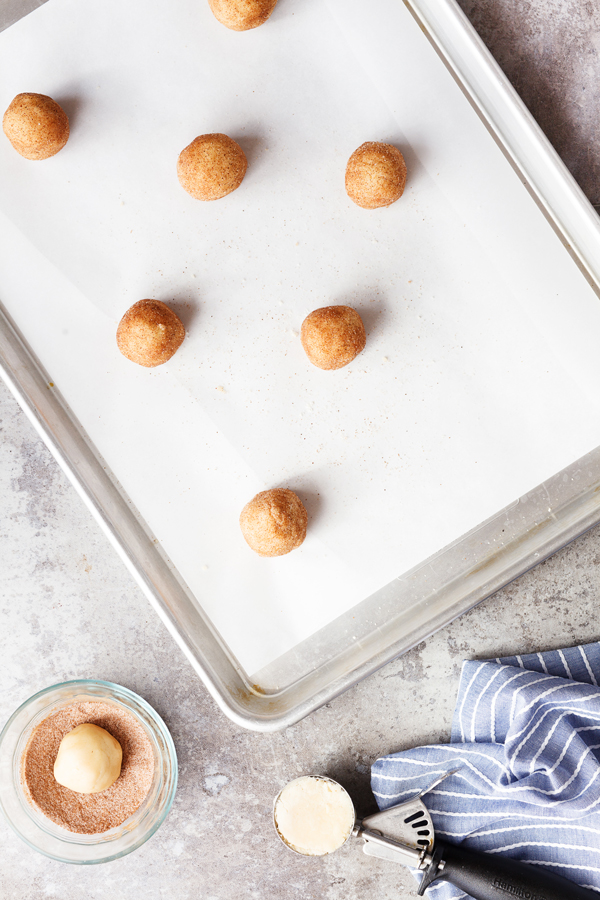 Preparation step for snickerdoodle cookies - dough balls on baking sheet