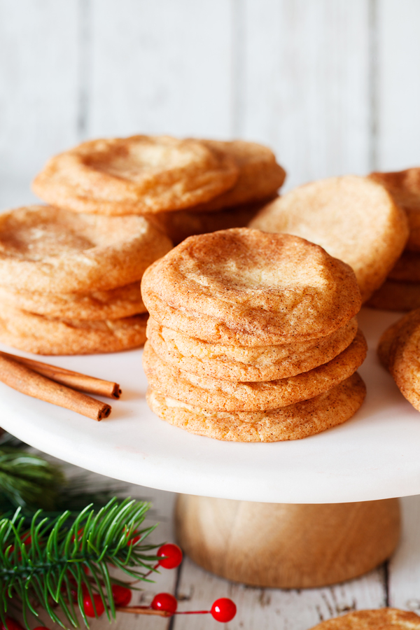 Piles of snickerdoodle cookies on serving plate.