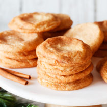 Piles of snickerdoodle cookies on serving plate.