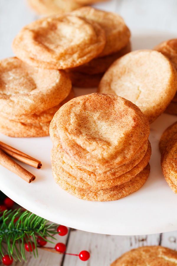 Piles of snickerdoodle cookies on serving plate.