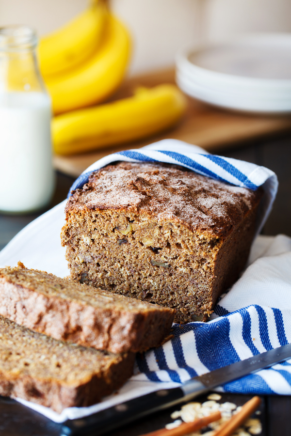 Loaf of healthier banana bread wrapped in tea towel.