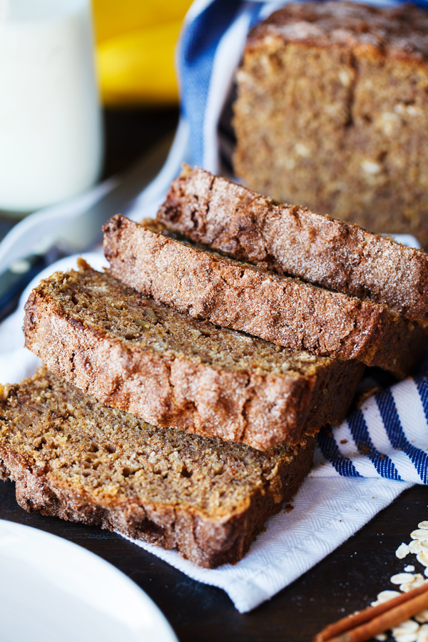 Slices of healthier banana bread on tea towel.