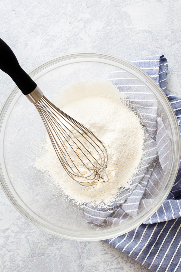 Preparation step for Martino's Bakery original tea cakes - dry ingredients in bowl with whisk