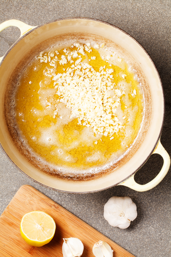 Preparation step for One Pot Pasta with Lemon Garlic Butter Sauce - garlic, butter and oil in pot