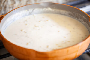 Macaroni cooking in skillet.