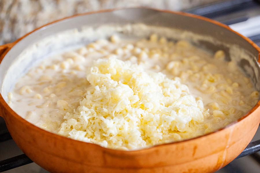 Cheese added to shrimp macaroni and cheese skillet